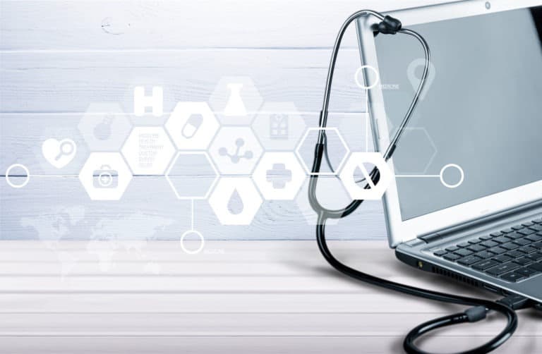 Silverline Managed Services Solutions: Laptop diagnosis with stethoscope on background