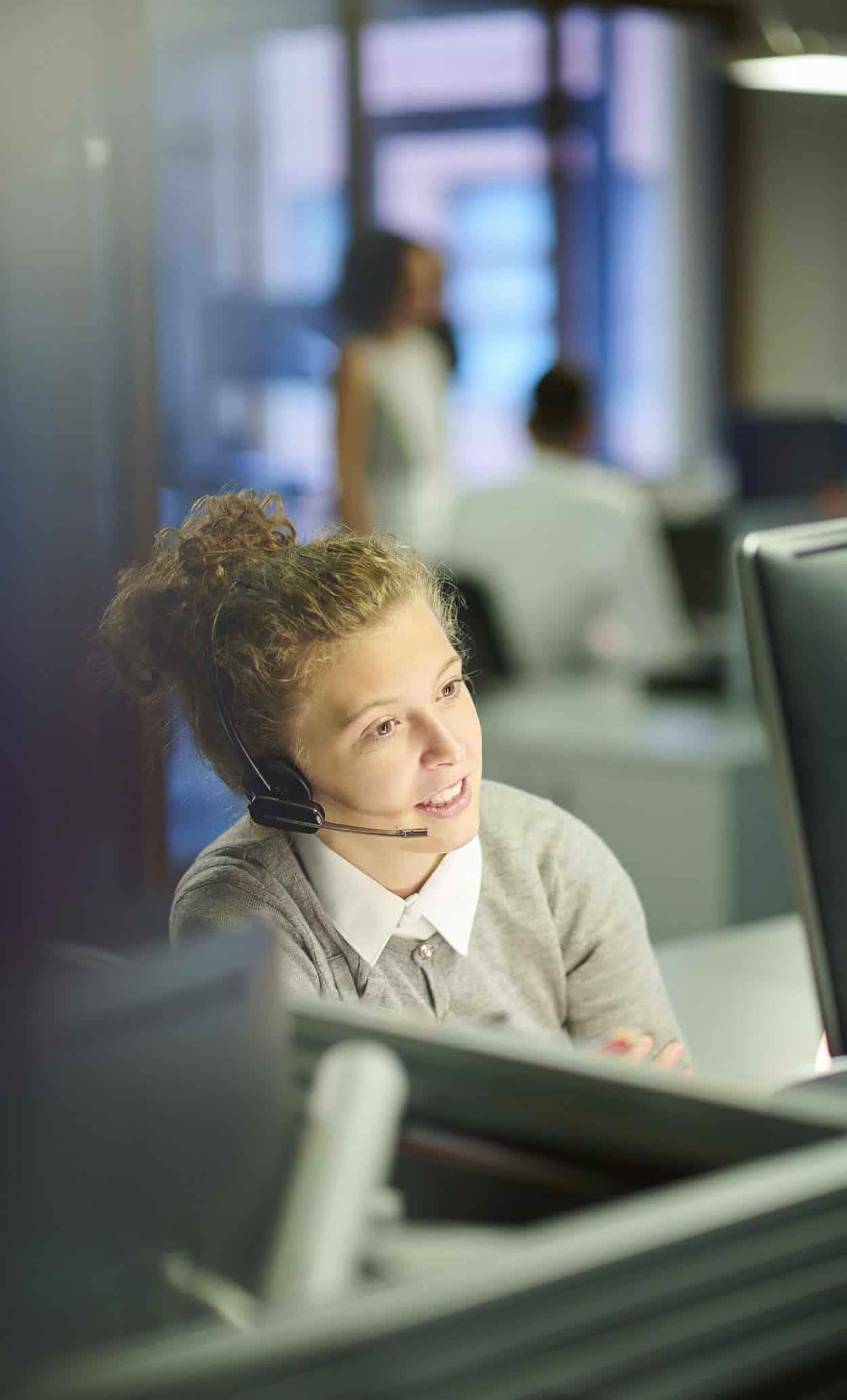 a female call centre worker at her terminal