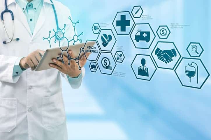2021 healthcare trends: Health Insurance Concept - Doctor in hospital with health insurance related icons in modern graphic interface showing symbol of healthcare person, money saving, medical treatment and benefits.