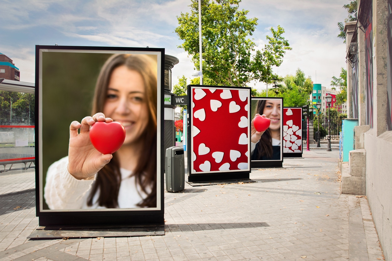 billboards, photographs of a woman with red heart