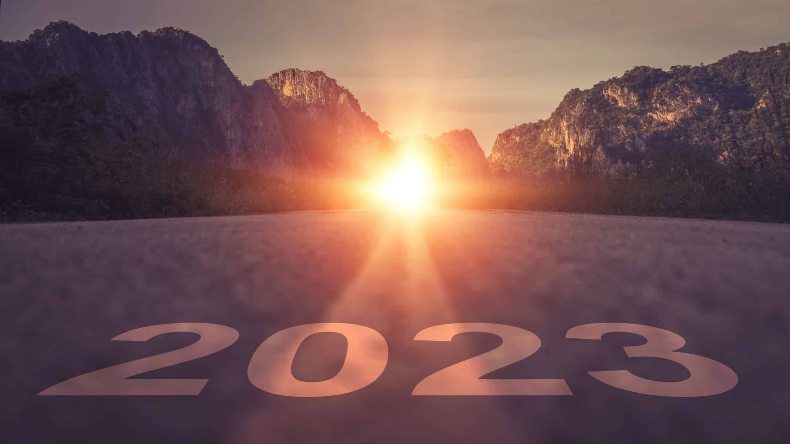 2023 written on asphalt road for new year at sunrise