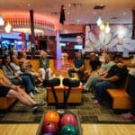 Silverliners sitting around table having a fun time at bowling
