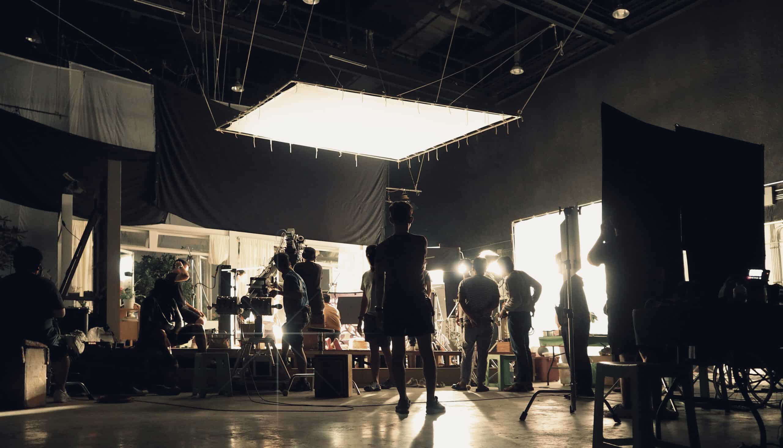 Image of team filming a movie in big production studio