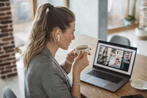 Women watching a webinar in her home
