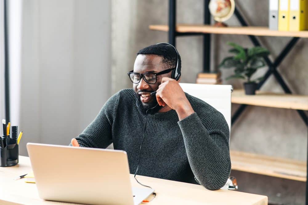 Payer Call Center employee answering questions while working from home